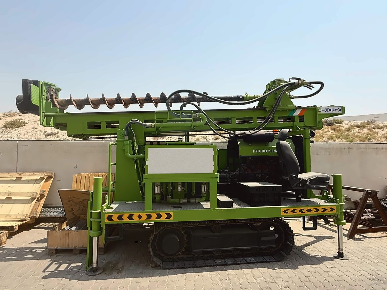 Crawler-mounted auger drilling rig, side view