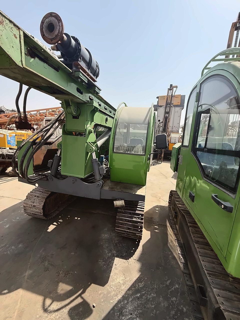 Crawler-mounted drilling rig, cab and mast