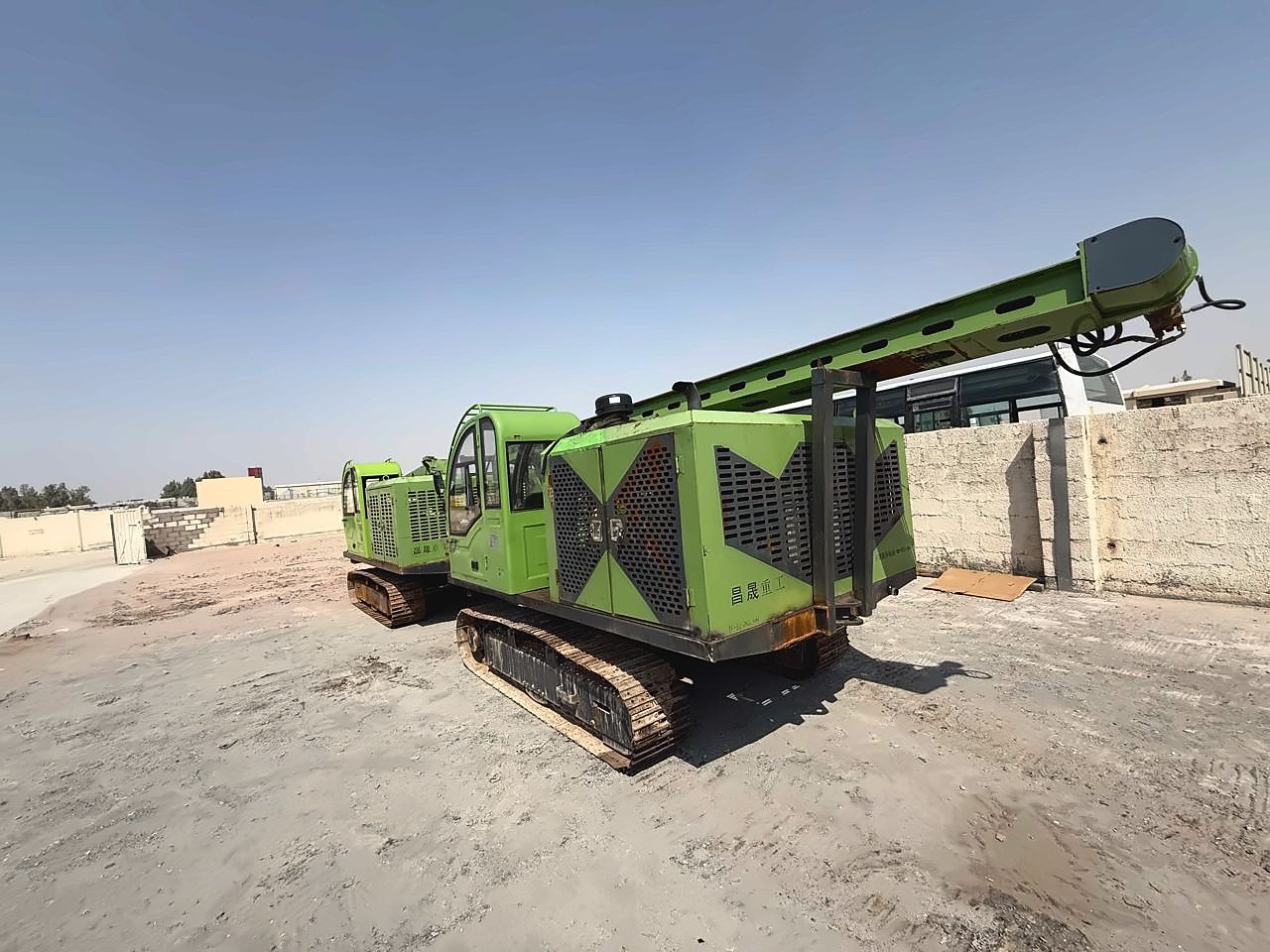 Crawler-mounted drilling rigs in the yard